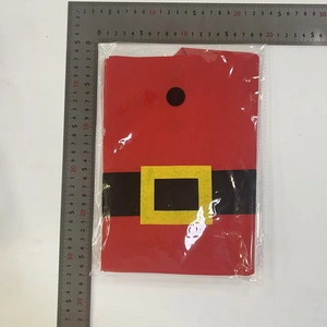 Detailed view of red Christmas felt gift bag with Santa belt design and measurement scale
