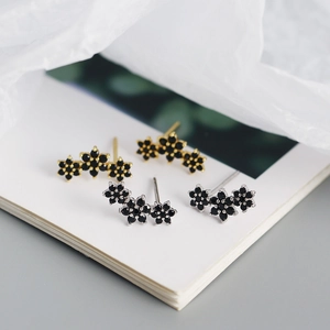 Elegant s925 silver flower stud earrings set in gold and silver finish with black crystals