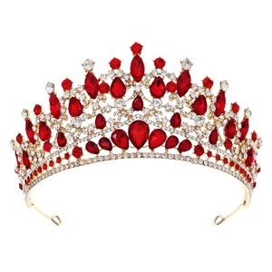 Elegant gold bridal crown with red rubies and crystal rhinestones on white background