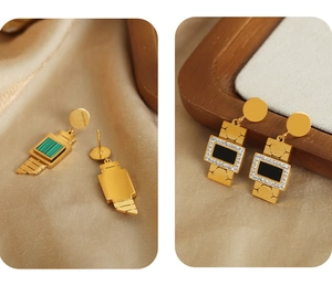 Macro detail of gold-plated titanium watch-shaped earrings with green and black dials