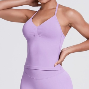 Detail of lavender seamless ribbed yoga set featuring V-neck strap top and high-stretch fabric