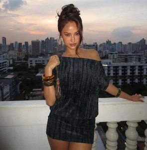 Detail of grey tie-dye bodycon dress with one-shoulder design and stylish cutout back