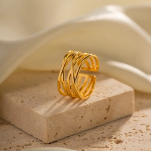 Minimalist 18K gold plated stainless steel multi-layer open ring on a textured stone