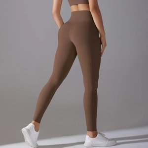 Close-up of high-waisted yoga leggings showing bum lifting seams and stretch fabric