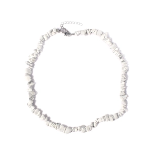Macro detail of irregular white crystal stone necklace with silver lobster clasp