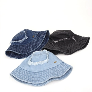 Retro distressed denim bucket hats with frayed holes in navy blue, black, and light blue