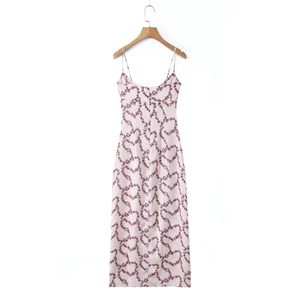 Back view of a slim-fit floral maxi dress with purple print on a pink background