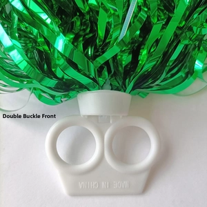 Detail of green metallic cheerleading pom-poms with white double-ring plastic handle grip