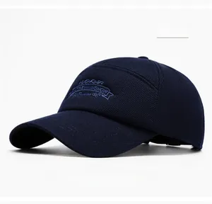 Detail of navy blue baseball cap with blue embroidery and adjustable strap closure