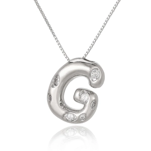 Macro shot of silver letter G pendant with white zircon stones and classic box chain