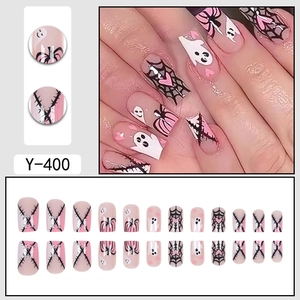 Pink and black Halloween press-on nails with ghost, pumpkin, and spiderweb patterns
