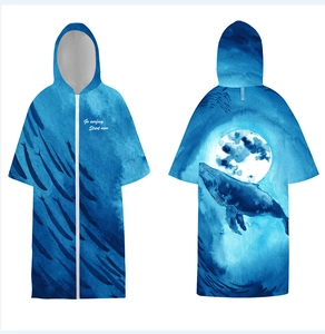 Detail of blue hooded quick-dry beach poncho with whale pattern and front zipper