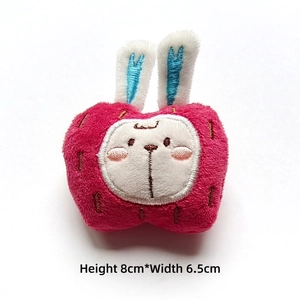 Detail of plush apple bunny brooch featuring soft embroidery, size 8cm by 6.5cm