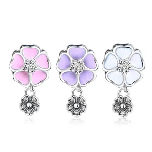 Floral magnolia pendant beads in pink, purple, and blue enamel with zircon accents