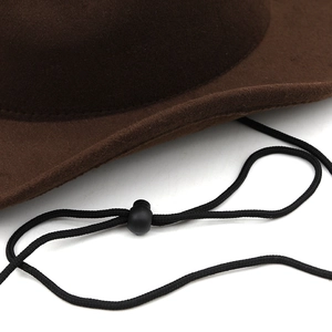 Close-up of the adjustable black chin strap on a dark brown wool felt western hat