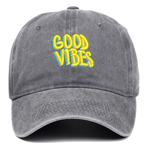 Close-up of GOOD VIBES 3D puff embroidery on gray washed cotton vintage baseball cap