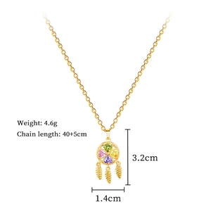 Macro detail of gold clover dreamcatcher necklace with colorful crystals and size specs