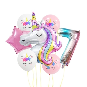 Rainbow unicorn birthday balloon set featuring a number 7 foil balloon and stars