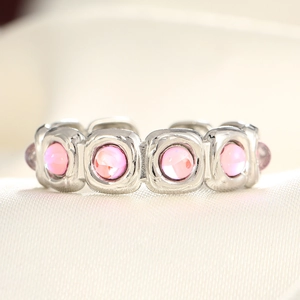 Polished silver adjustable ring featuring multiple square-set pink round gemstones