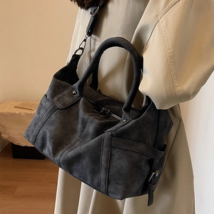 Large capacity dark grey vintage Boston bag with adjustable strap shown on shoulder