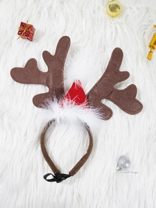 Macro view of Christmas reindeer antlers dog headband with festive holiday decorations