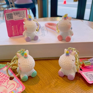 Set of four cute unicorn keychains with colorful 3D woven texture and gold metal rings
