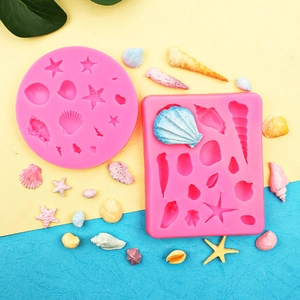 Pink starfish and seashell silicone molds for ocean themed fondant cake decorations