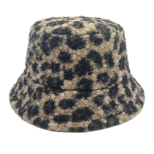 Close-up of leopard print faux shearling fabric and texture on a warm winter bucket hat