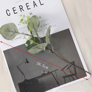 Detail of 28.5cm faux eucalyptus branch on Cereal magazine with dimensions
