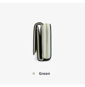 Detail view of mint green wallet featuring gold zipper closure and accordion structure