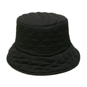Close-up of black quilted bucket hat featuring classic diamond stitch and glossy fabric