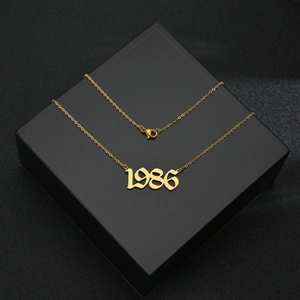 Golden 1986 birth year pendant necklace in stainless steel with elegant lobster clasp