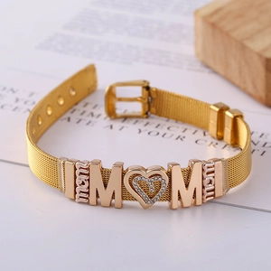 Detail of gold mesh stainless steel bracelet with sparkling MOM heart charm