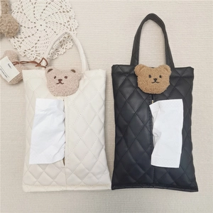 Macro shot of PU leather car tissue box covers with cute plush bear head and quilt pattern