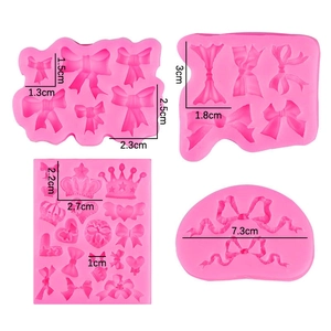 Pink silicone molds with crown and bow patterns in four sizes for DIY crafts