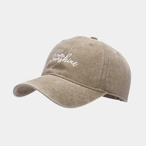 Detail of hello Sunshine embroidery on washed khaki vintage baseball cap with cotton texture