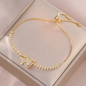 Macro shot of gold adjustable rabbit charm bracelet with sparkling zircon stones