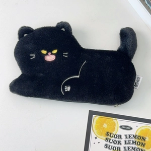 Close-up of the plush black cat pencil case featuring yellow eyes and a cute tail