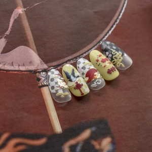 3D embossed press-on nails featuring traditional Chinese fans and cloud patterns