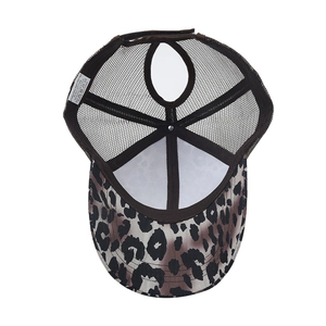 Detailed view of leopard print ponytail mesh hat showing breathable back and fabric labels
