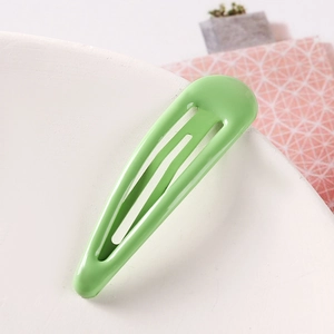 Close-up of grass green candy-colored teardrop BB hair clip with smooth matte finish