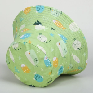 Detail of green sun hat with cartoon ocean fish print and reinforced wide brim