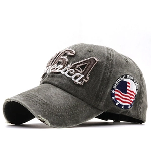 Washed grey cotton baseball cap with 1964 America embroidery and vintage distressed finish