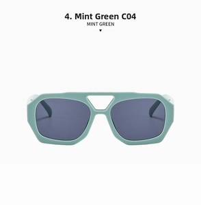 Detail view of avant-garde mint green geometric sunglasses with dark grey lenses C04