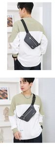 Front and back views of a dark grey waterproof nylon sport waist bag with adjustable strap
