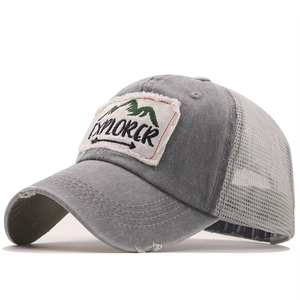 Distressed grey mesh trucker hat with Explorer patch and outdoor mountain embroidery