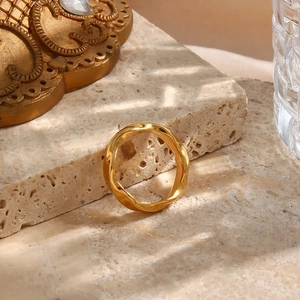Elegant gold plated stainless steel ring featuring a modern geometric wavy twist design
