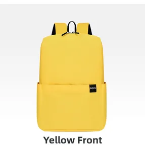 Front detail of a bright yellow nylon backpack with black zippers and BOYU side label