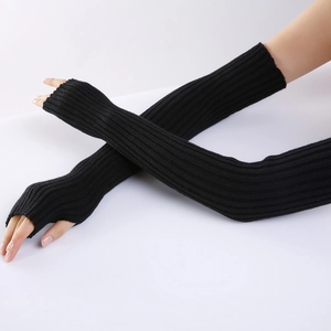 Detail of black ribbed knit arm warmers and long fingerless gloves on arm