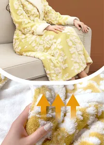 Close-up of thick yellow flannel bathrobe with floral texture and white fleece trim